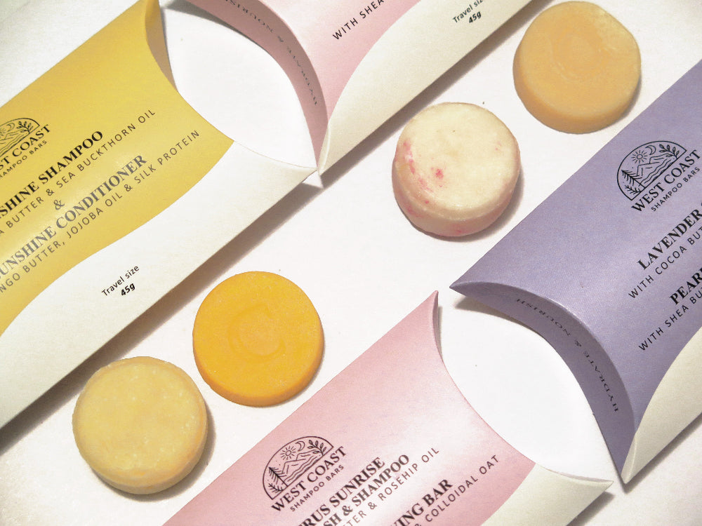West Coast shampoo and conditioner bars with their paper packaging. Eco friendly hair care for every hair type